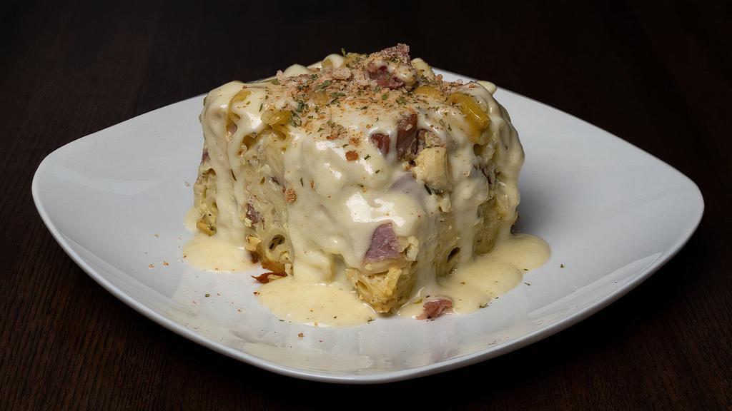 Knock You Naked Noodles & Ham · Chunks of smoked ham with pasta, gruyère, cream, and herbs served with side salad.