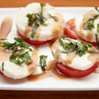Tomato Caprese · Indiana tomatoes, fresh mozzarella, basil.