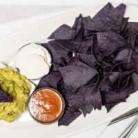 Homemade Guacamole & Chips · Served with homemade salsa and sour cream. Vegan and gluten free.