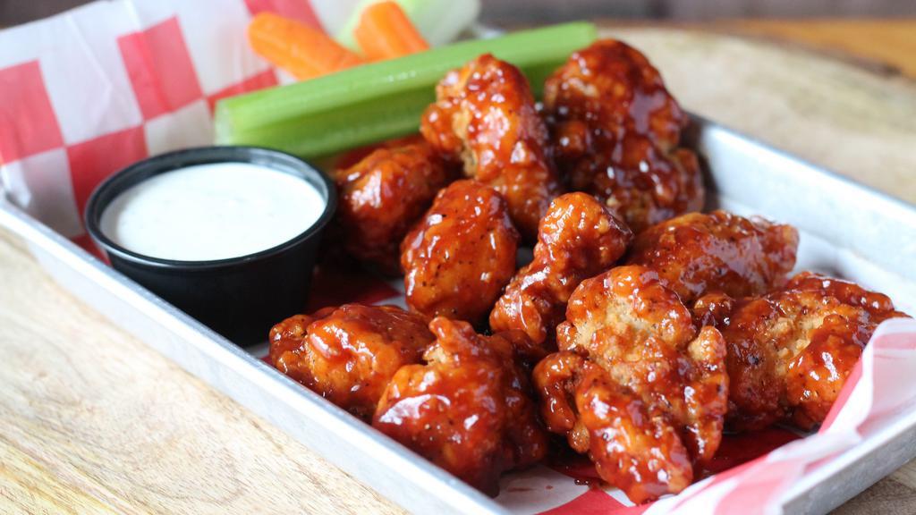 Boneless Wings · Half pound of boneless wings tossed in your choice: dry rub, hot, mild, BBQ, sweet ginger teriyaki or Nashville hot. With carrots and celery and your choice of ranch or bleu cheese.