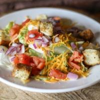 House Salad · Lettuce, tomato, onion, shredded cheese, croutons side of dressing.