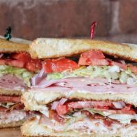 Classic Club Sandwich · Triple decker oven roasted turkey, ham, bacon, lettuce, tomato, onion and mayo.