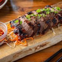 Crying Tiger · Grilled marinated flank steak, chopped scallion, toasted rice powder, tamarind salsa. It was...