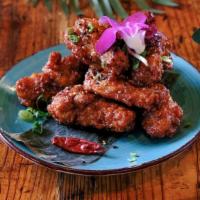 Bites Wings · Crispy chicken wings tossed in homemade sauce. 8pcs.