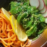 Seaweed Salad (V)(Gf) · Dressed with rice wine vinaigrette. Served with carrots, sliced cucumbers, fresh radish and ...