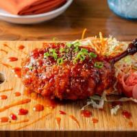 General Tso Duck Leg · Braised & battered, wasabi slaw, pickled ginger. Drenched in General Tso Good sauce.