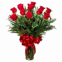 Traditional Dozen Roses · Classic red roses designed in a glass vase with greenery.