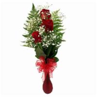 Triple Rose Bud Vase · Three red roses arranged in a vase with baby's breath and greenery.