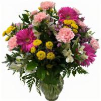 Spring Garden Vase Arrangement · A collection of fresh colorful flower designed in a crystal garden vase