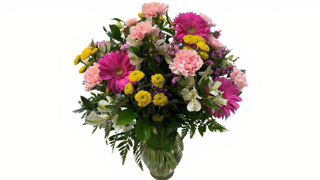 Spring Garden Vase Arrangement · A collection of fresh colorful flower designed in a crystal garden vase