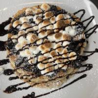 S'Moreo Pancakes · Toasted marshmallows, Ghirardelli chocolate sauce, chocolate chips and crumbled Oreos.