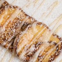 Cinnamon Roll French Toast · Three slices of cinnamon roll bread dipped in our Mexican vanilla, cinnamon infused batter a...