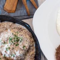 Biscuits & Gravy With Sausage & Eggs · Two large, flaky biscuits smothered in our flavorful sausage gravy with eggs, hand-pattied s...