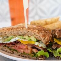 Blt+Ea
 · Avocado, hickory smoked bacon, lettuce, tomato, over hard egg and pesto aioli on multigrain ...