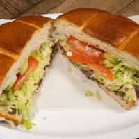 Tortas · Steak, tinga or chicken, served with refried beans, lettuce, tomato, and sour cream.