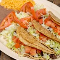 Taco Dinner · Steak, tinga or chicken, served with refried beans, rice, and salad.