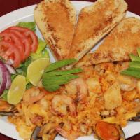 Arroz Con Mariscos · Shrimp, octopus, catfish and clams served with rice.