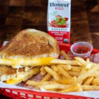 Kids Grilled Cheese Meal · American Cheese on Ry Toasted Bread. Comes with Fries and a juice box.