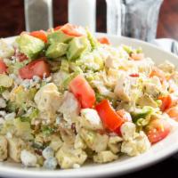 The Wildfire Chopped Salad · Roasted chicken, avocado, tomatoes, blue cheese, bacon, scallions, corn, tortilla strips, ci...