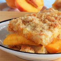 Peach Cobbler Parfait · Delicious peaches with granola and vanilla yogurt parfait.
