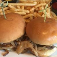 Detroit Sliders · Three black Angus sliders served with grilled onions and a pickle.