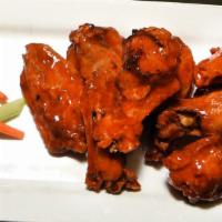 Urban Wings · Buffalo, Caribbean jerk, sesame soy or Parmesan garlic, served with carrots, celery, and blu...