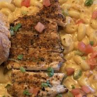 Blackened Chicken Pasta · Cavatappi pasta, blackened chicken breast, charred tomatoes, peppers, and onions in a delici...
