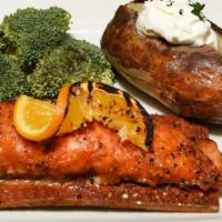 Cedar Planked Salmon · Marinated in orange Asian zing sauce, served with seasonal vegetable and baked potato.