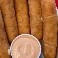 Tequenõs · five fried spear of bread dough with the Venezuelan Cheese(queso de mano) stuffed in the mid...