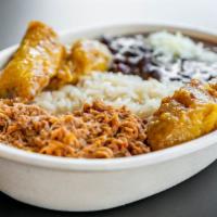The Venezuelan Beef · Traditional Venezuelan dish (Pabellón Criollo) with white rice, black beans, fried sweet pla...