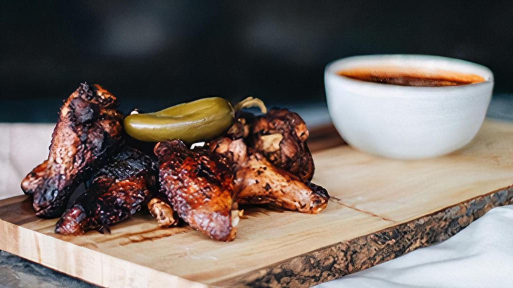 Fire-Kissed Wings Dinner · Rubbed with special spices & grilled over hickory. Includes one side.