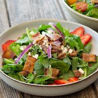 Spinach Salad · Strawberries, maple spiced pecans, bacon, feta cheese, red onion, and sweet vinaigrette