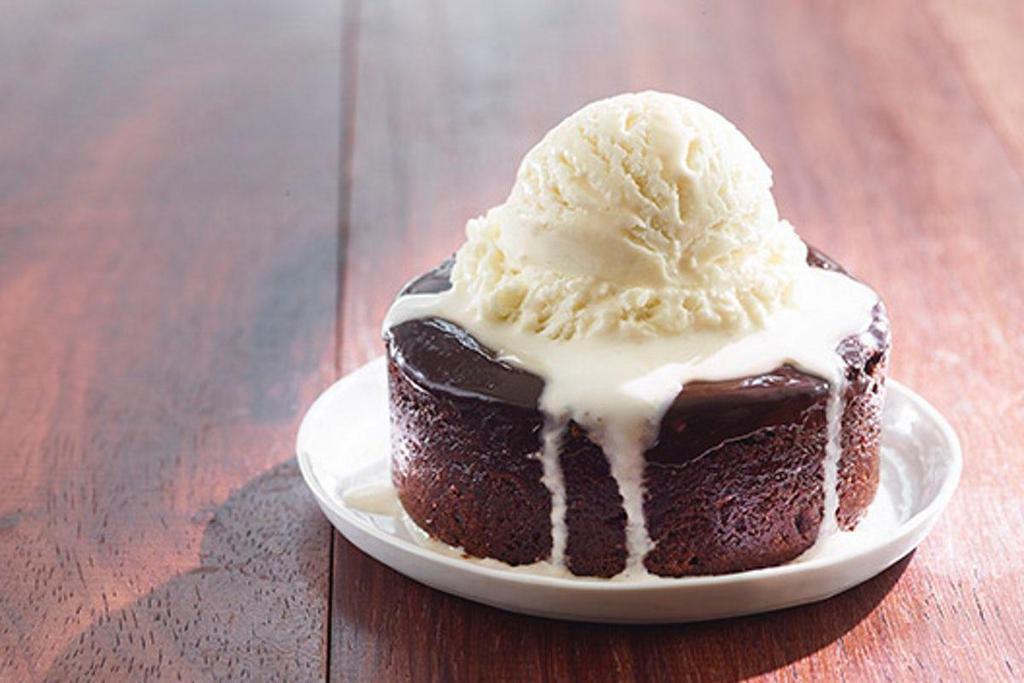 Triple Chocolate Brownie · Rich chocolate brownie topped with chocolate ganache & served with vanilla bean ice cream
