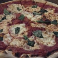 Margherita Pizza · Fresh tomato, basil and mozzarella.