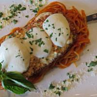 Eggplant Parmigiana · Fresh eggplant, baked with marinara and mozzarella cheese served with pasta. Served with cho...