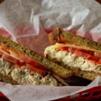 Mimi’S Melody (Regular) · Homemade white albacore tuna salad, white cheddar, tomato, Russian dressing grilled on rye.