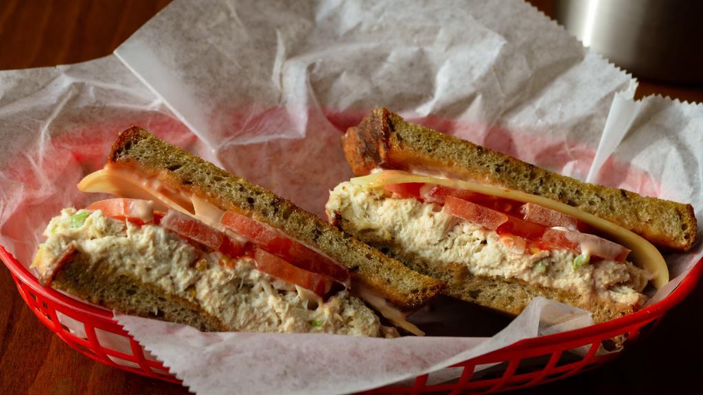 Mimi’S Melody (Regular) · Homemade white albacore tuna salad, white cheddar, tomato, Russian dressing grilled on rye.