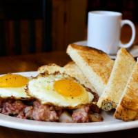 Eric'S Corned Beef Hash · Eric's seriously delicious corned beef hash with two fried eggs and rye toast