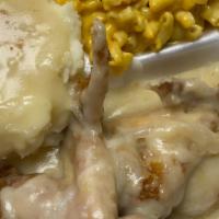 Smothered Chicken · includes 2 sides