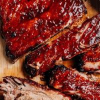 Baby Back Bbq Ribs · (4 Ribs ) Served with rice , and honey butter  cornbread