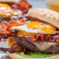 Sultan Of Swat Burger · 1/2 pound burger, cheddar cheese, fried egg, lettuce, tomato, uptown sauce on a brioche bun.