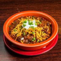 4 Bean Vegetarian Chili · Hearty and spicy chili topped with Cheddar, sour cream and scallions.