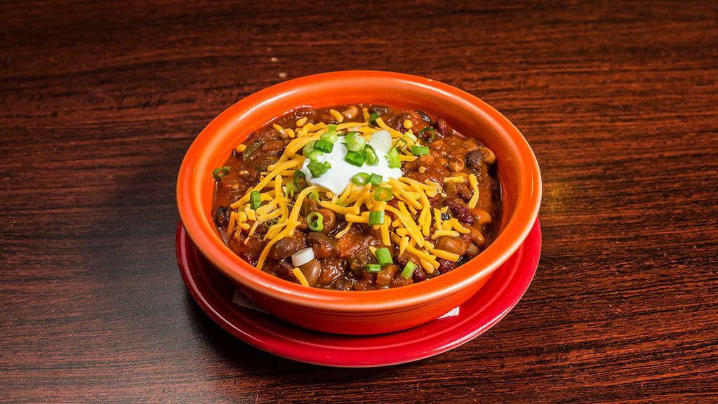 4 Bean Vegetarian Chili · Hearty and spicy chili topped with Cheddar, sour cream and scallions.