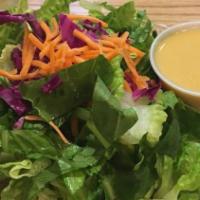 Garden Salad · A bed of romaine lettuce with cucumbers, carrots, tomatoes, artichoke hearts and a choice of...