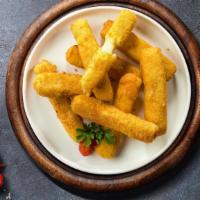 Stretch The Cheese Sticks · (Vegetarian) Mozzarella cheese sticks battered and fried until golden brown. Served with mar...