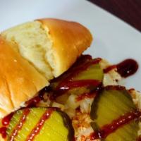 Pulled Chicken Sandwich · Dad's Pulled Chicken topped with onions, pickles and BBq sauce. 
Optional add cheese.