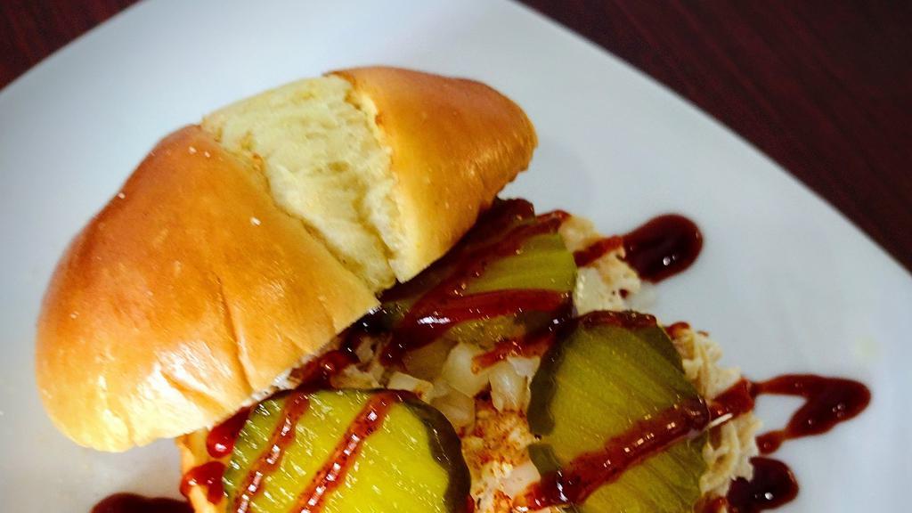 Pulled Chicken Sandwich · Dad's Pulled Chicken topped with onions, pickles and BBq sauce. 
Optional add cheese.