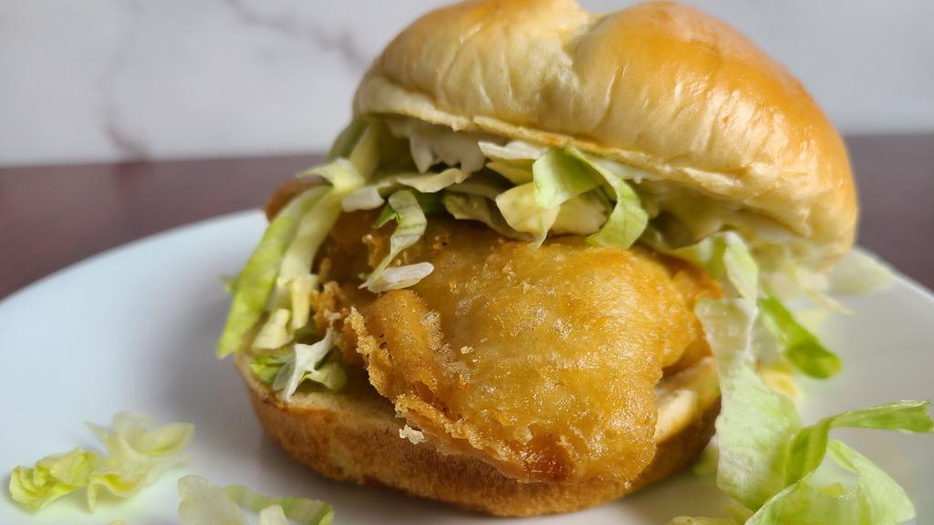 Fish Sandwich · Cod fillet topped with tartar sauce and lettuce. Optional add cheese.