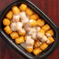 Large Queso Tots · Large order of tots topped with Queso sauce.