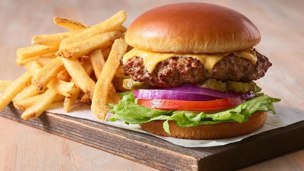 Classic Cheeseburger · A juicy all-beef burger classic with your choice of two cheese slices, lettuce, tomato, onion and pickles on a Brioche bun. Served with fries.